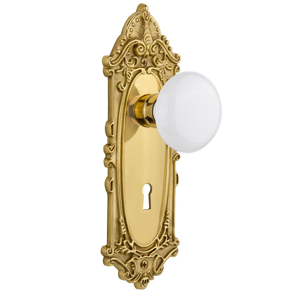 Nostalgic Warehouse Privacy Victorian Plate with Keyhole and White Porcelain Door Knob in Polished Brass