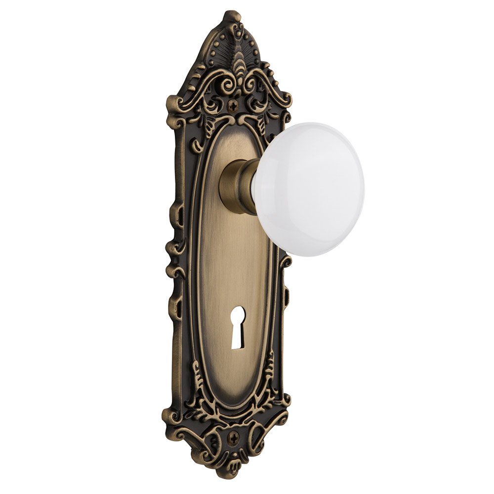 Nostalgic Warehouse Passage Victorian Plate with Keyhole and White Porcelain Door Knob in Antique Brass