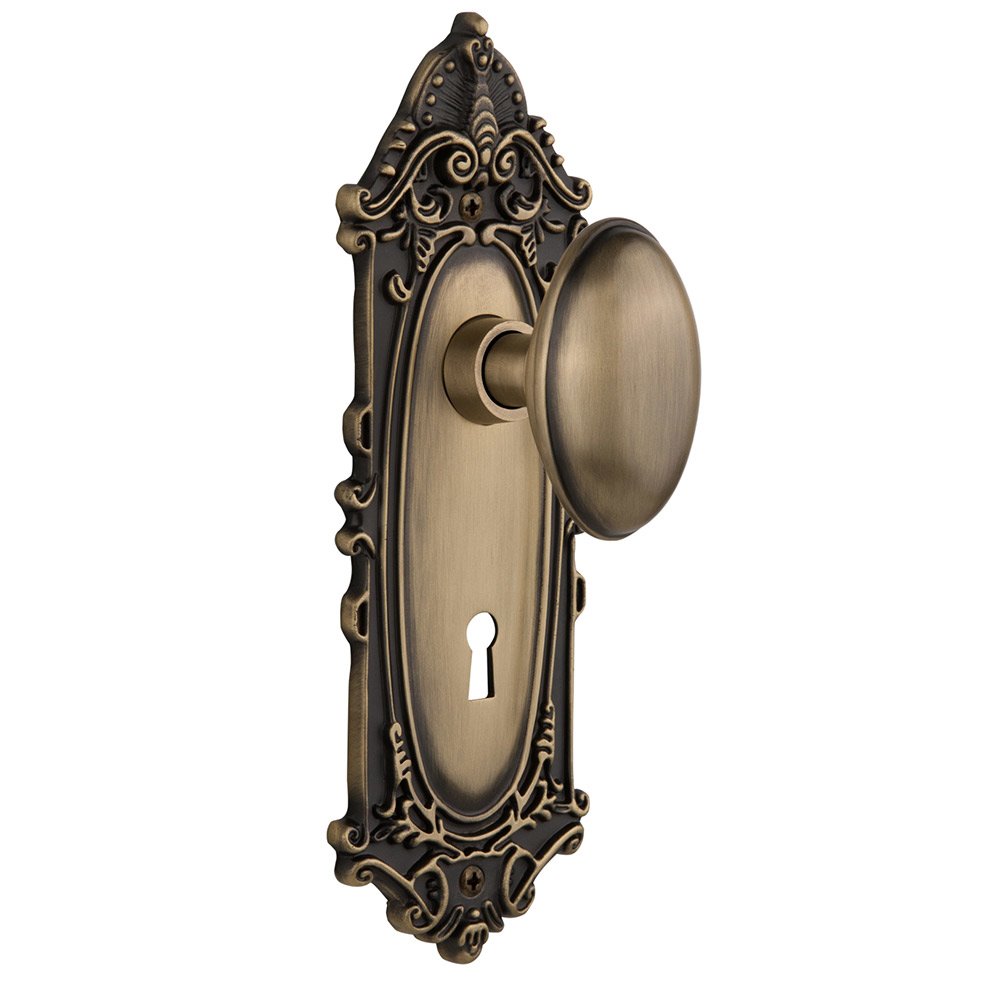 Nostalgic Warehouse Double Dummy Victorian Plate with Keyhole and Homestead Door Knob in Antique Brass