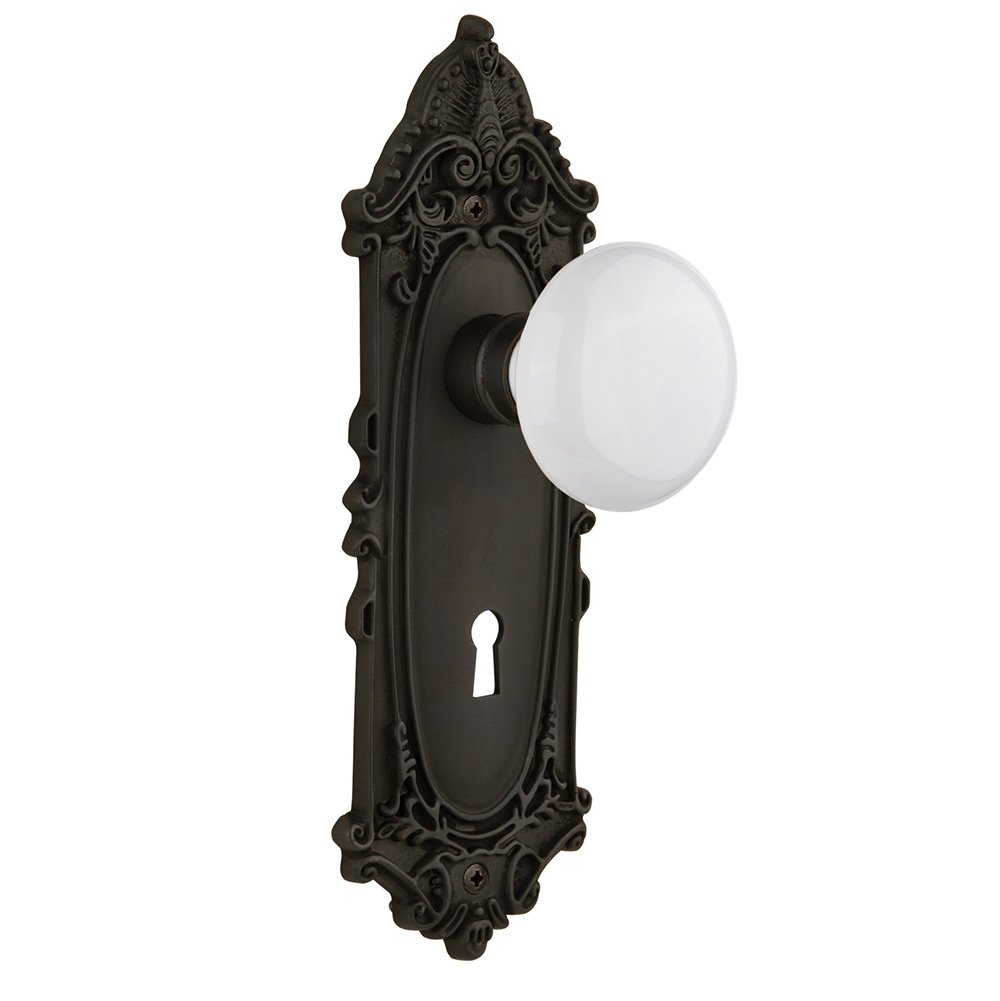 Nostalgic Warehouse Privacy Victorian Plate with Keyhole and White Porcelain Door Knob in Oil-Rubbed Bronze