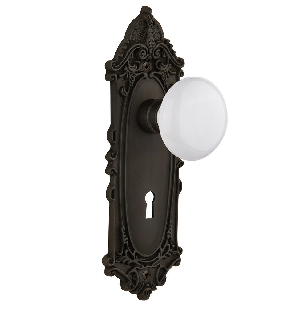 Nostalgic Warehouse Passage Victorian Plate with Keyhole and White Porcelain Door Knob in Oil-Rubbed Bronze