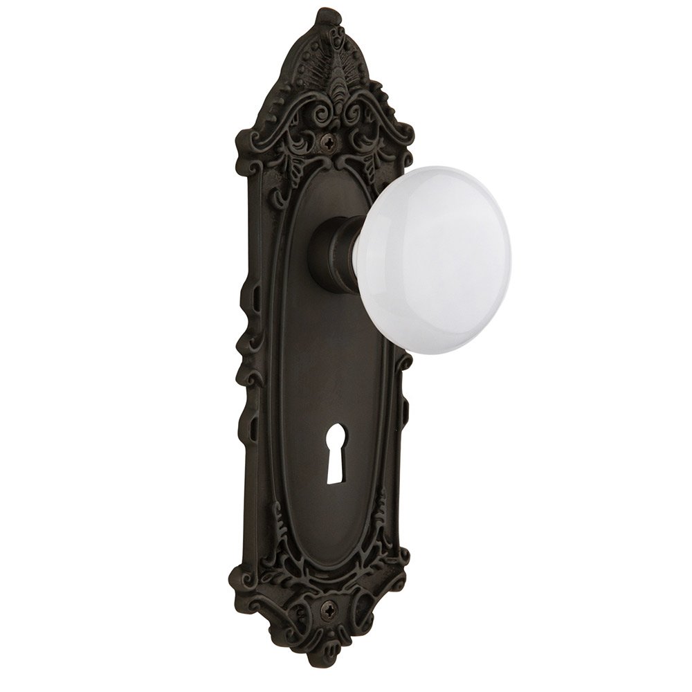 Nostalgic Warehouse Double Dummy Victorian Plate with Keyhole and White Porcelain Door Knob in Oil-Rubbed Bronze