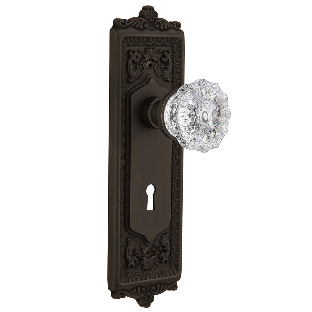 Nostalgic Warehouse Privacy Egg & Dart Plate with Keyhole and Crystal Glass Door Knob in Oil-Rubbed Bronze