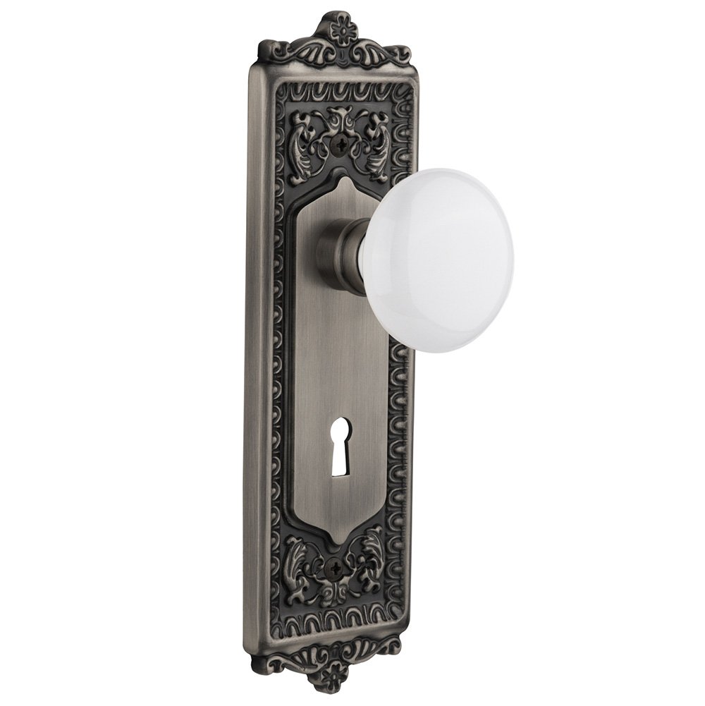 Nostalgic Warehouse Privacy Egg & Dart Plate with Keyhole and White Porcelain Door Knob in Antique Pewter