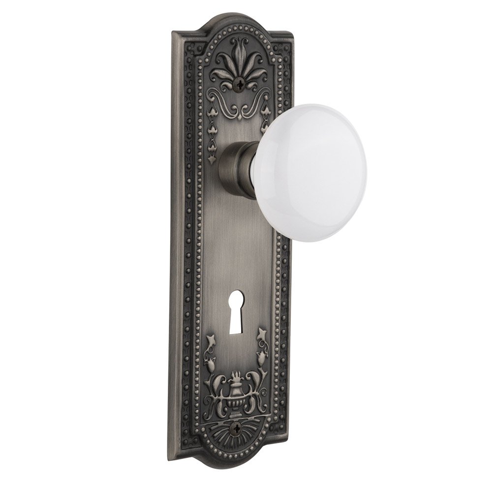 Nostalgic Warehouse Privacy Meadows Plate with Keyhole and White Porcelain Door Knob in Antique Pewter