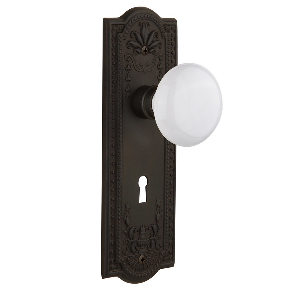 Nostalgic Warehouse Privacy Meadows Plate with Keyhole and White Porcelain Door Knob in Oil-Rubbed Bronze