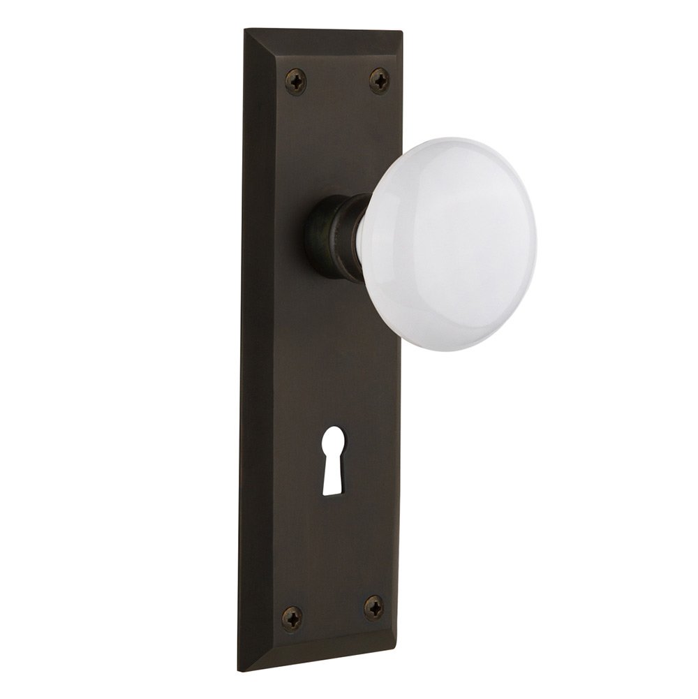 Nostalgic Warehouse Privacy New York Plate with Keyhole and White Porcelain Door Knob in Oil-Rubbed Bronze
