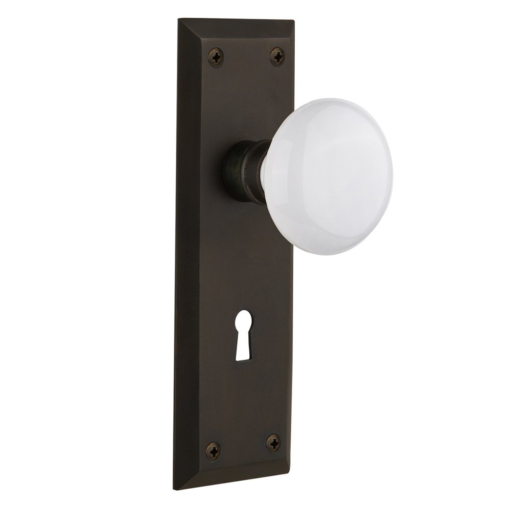 Nostalgic Warehouse Passage New York Plate with Keyhole and White Porcelain Door Knob in Oil-Rubbed Bronze
