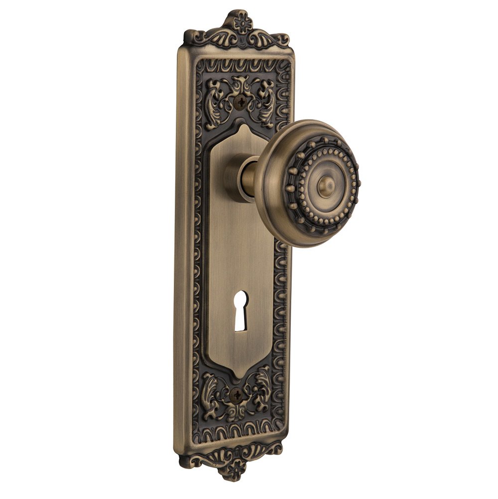 Nostalgic Warehouse Passage Egg & Dart Plate with Keyhole and Meadows Door Knob in Antique Brass