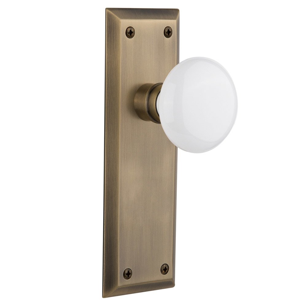Nostalgic Warehouse Double Dummy New York Plate with White Porcelain Door Knob in Antique Brass
