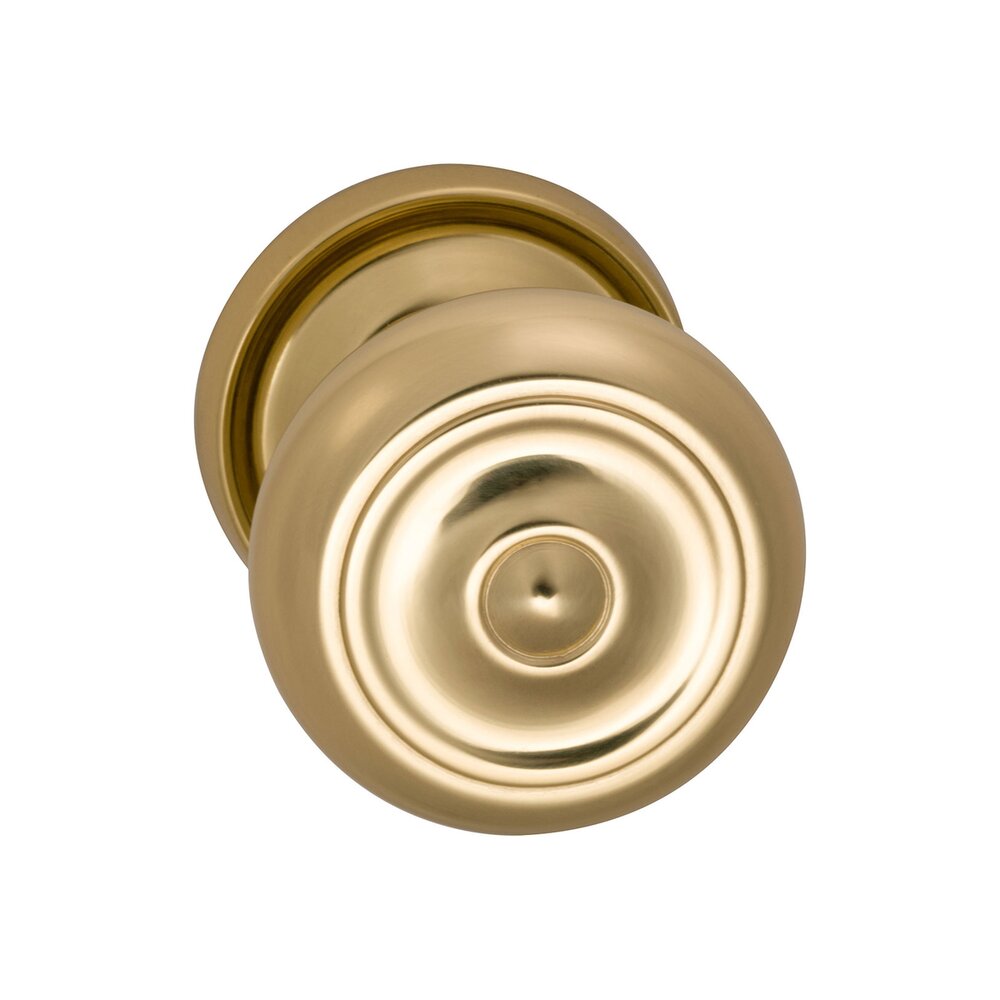 Omnia Hardware Passage Traditions Classic Door Knob with Medium Radial Rosette in Polished Brass Unlacquered