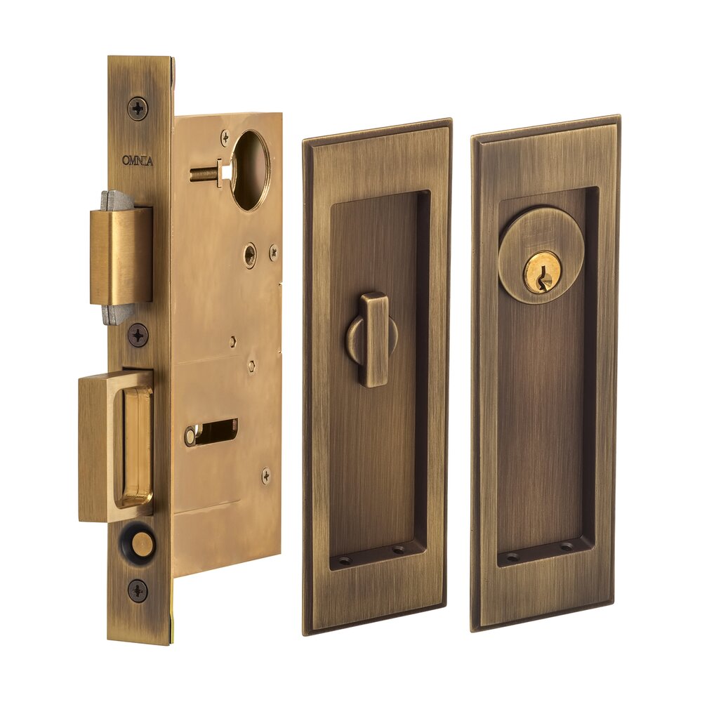 Omnia Hardware Large Stepped Rectangle Keyed Pocket Door Mortise Lock in Antique Brass Lacquered