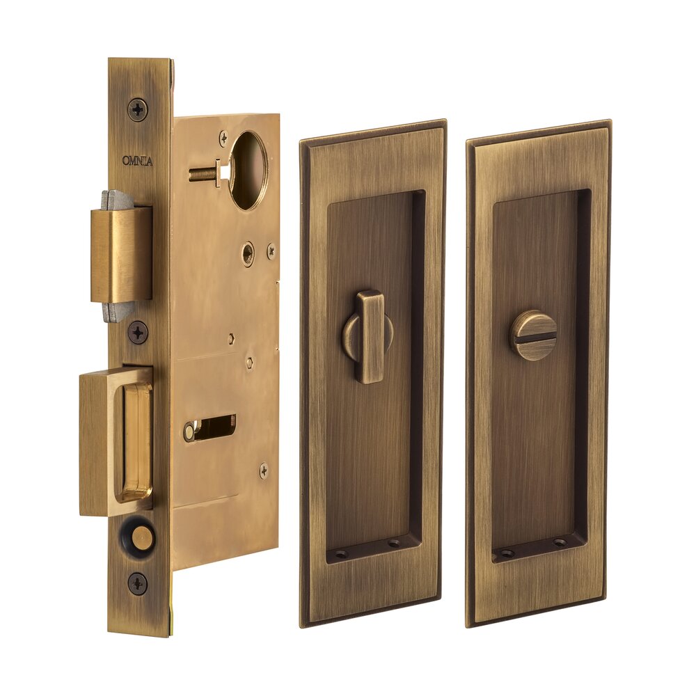 Omnia Hardware Large Stepped Rectangle Privacy Pocket Door Mortise Lock in Antique Brass Lacquered