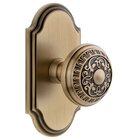 Grandeur Arc Plate Privacy with Windsor Knob in Vintage Brass